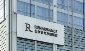 富力地产，再次“削债”